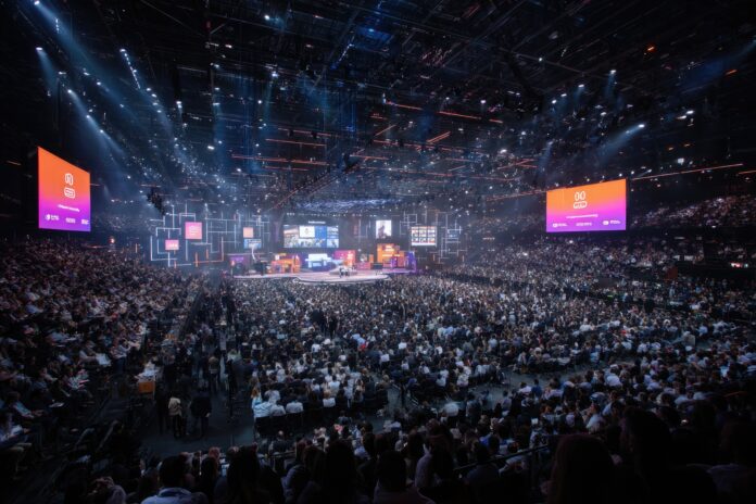 A wide-angle view of the VivaTech 2025 main startup stage bustling with participants and large screens displaying innovation awards.