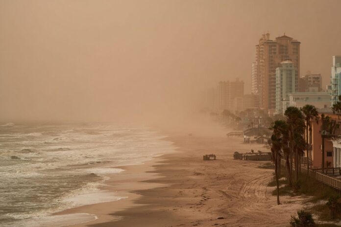 A thick haze from a Saharan dust cloud blankets the Florida coastline