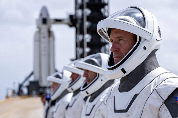 Axiom Mission 4 crew prepares for launch at Kennedy Space Center, with the SpaceX Falcon 9 and Dragon spacecraft in the background.