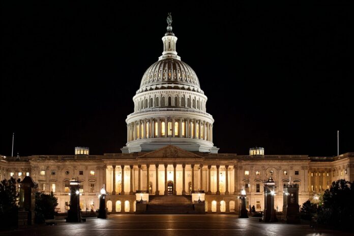 US Capitol Building lit up at night representing legislative action