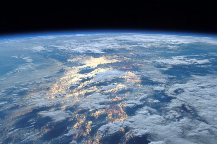 Satellite view of Earth’s atmosphere capturing cloud cover and heat signatures