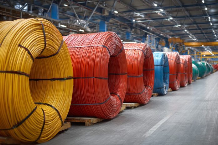 High-voltage power cables coiled in a manufacturing facility