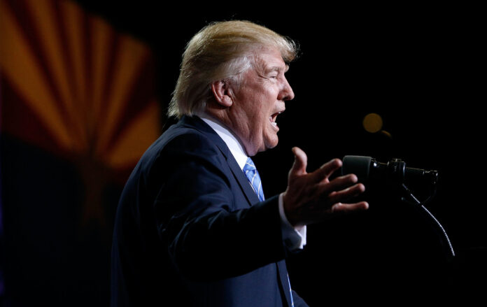 Donald Trump mid-interview looking pensive during a televised discussion.