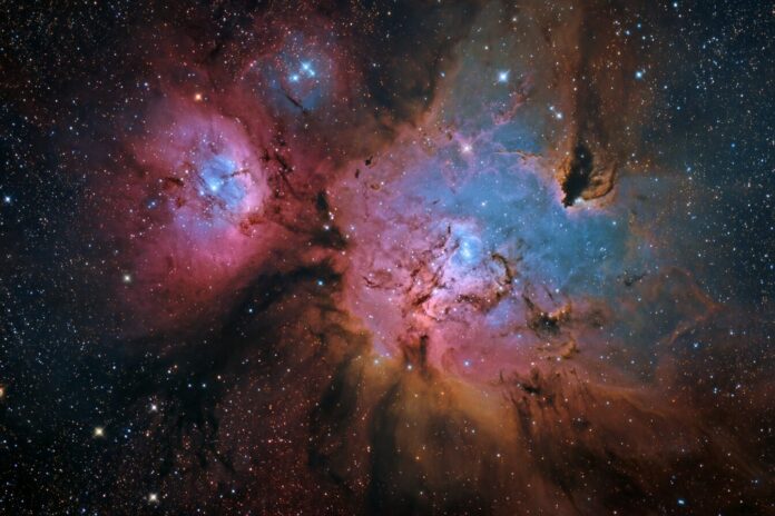 Stunning high-resolution image of the Trifid and Lagoon Nebulas captured by the Rubin Observatory, showcasing intricate clouds of gas and vivid colors.