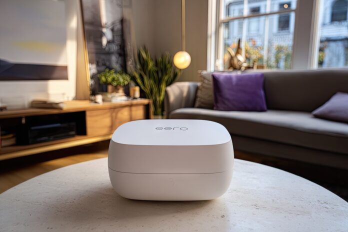 A sleek Eero Wi-Fi mesh router on a table in a modern living room.