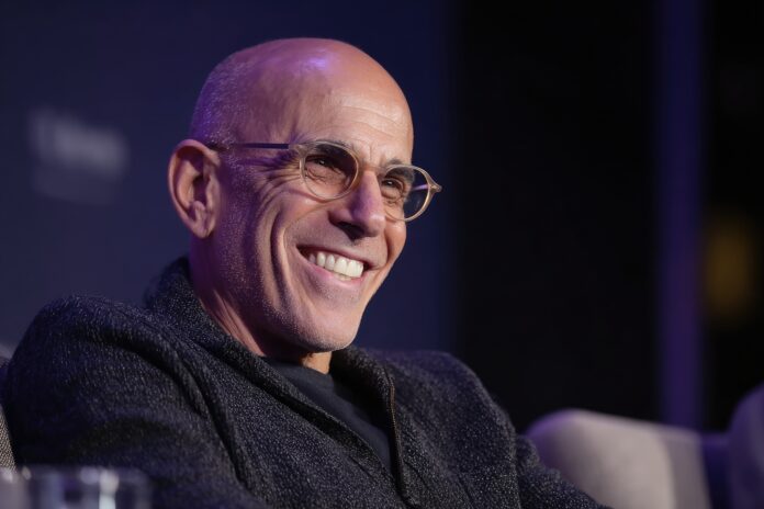 Jeffrey Katzenberg smiling and speaking at a tech investment event