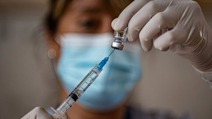 A vial of the first-ever gonorrhea vaccine being prepared for use in a clinical setting.