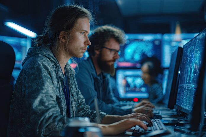 Cybersecurity analysts reviewing malware data in a secure control room