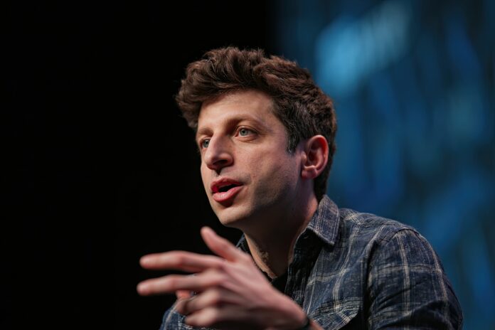 Sam Altman addressing an audience at a technology conference