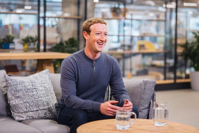 Mark Zuckerberg in a modern office setting discussing AI recruitment strategy