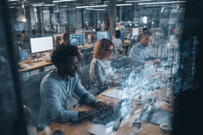 An AI-powered team collaborating inside a modern office, highlighting technology integration