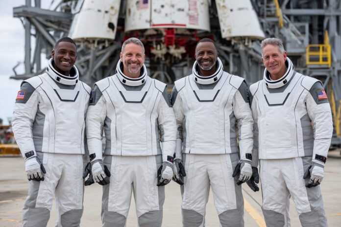 Axiom Mission 4 crew posing in their flight suits before launch at Kennedy Space Center
