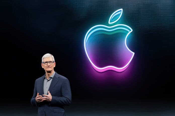Apple CEO unveiling new operating system branding at WWDC 2025.