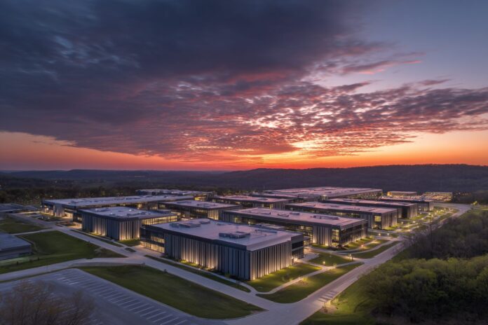 Aerial view of a futuristic data center at sunrise in a burgeoning tech hub