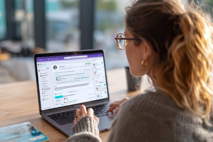 Person using Perplexity Comet browser with AI sidebar