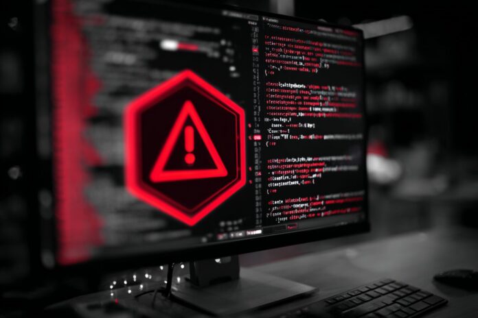 A code editor window with a warning sign overlay, representing a hijacked npm package.