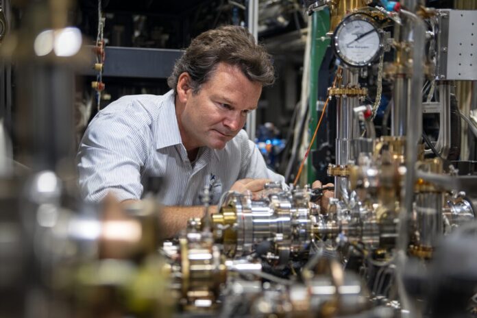 NASA researcher examines advanced radioisotope heat source equipment for space missions.