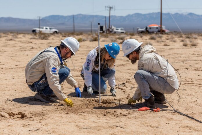 NASA X-59 research team in the Mojave Desert setting up ground microphones.