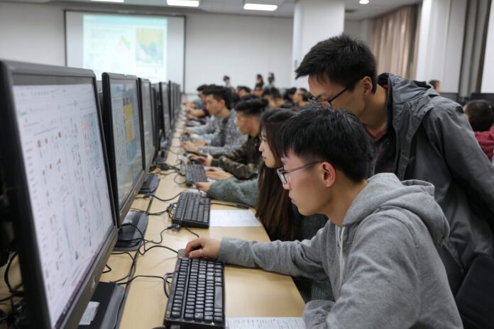 Students attending an AI-focused class at a leading Chinese university, engaging with interactive digital tools.