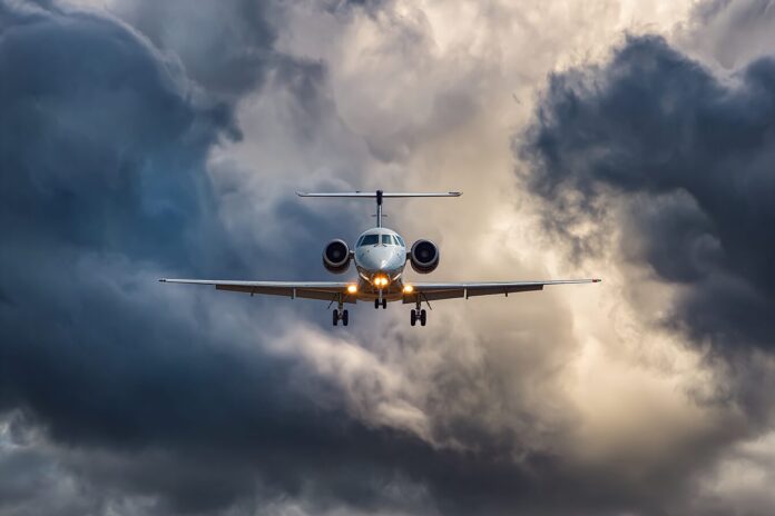 A SkyWest jet on approach under a dramatic sky, representing situational awareness in flight.