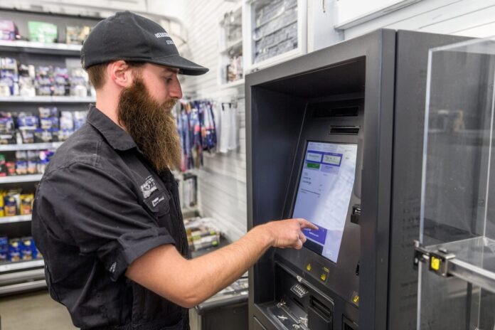Authorities checking a sealed digital currency ATM in a New Zealand retail store