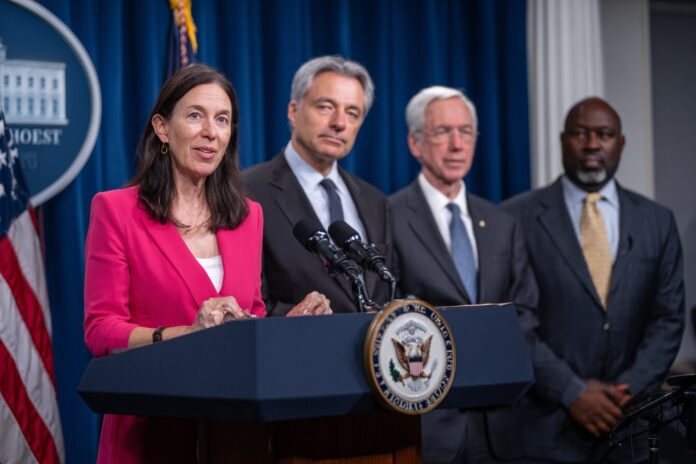 Trump Administration officials at a podium announcing the AI Action Plan