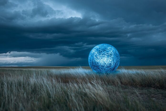 Large, blue orb floating above grassy field during thunderstorm in Alberta