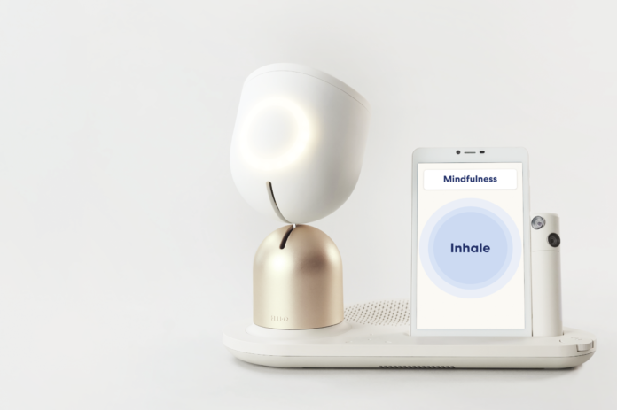 ElliQ Robotic Companion on Bedside Table