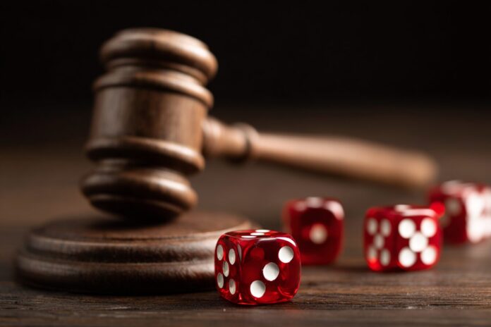 A gavel and gaming dice symbolizing legislative impact on the gaming industry in India.