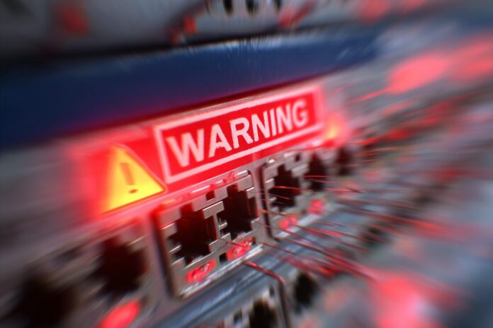 An illustrative close-up of a SonicWall firewall, blurred out with a digital ransomware warning overlay.