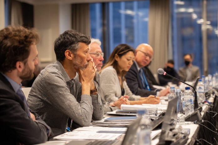 AI ethics committee deliberating on best practices and risk management.