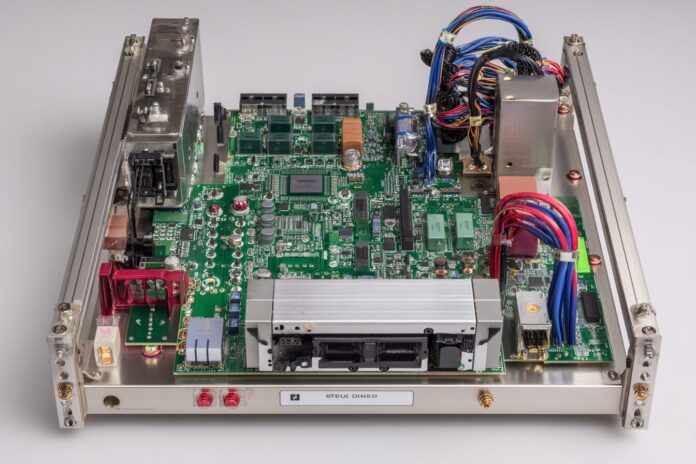 Top-down view of the der8enchtable open-air test bench with motherboard, GPU brace, and active PCB headers visible