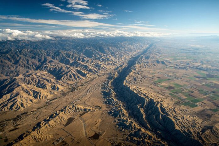 Aerial view of the San Andreas Fault cutting through the California landscape, illustrating the region's complex tectonics.