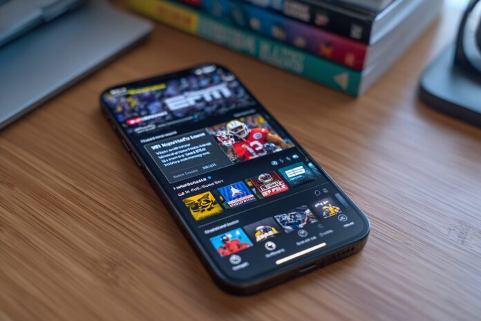 A smartphone displays the ESPN streaming app featuring live sports content and navigation options.