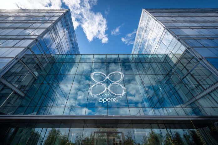 OpenAI headquarters facade, with modern glass and the company logo.