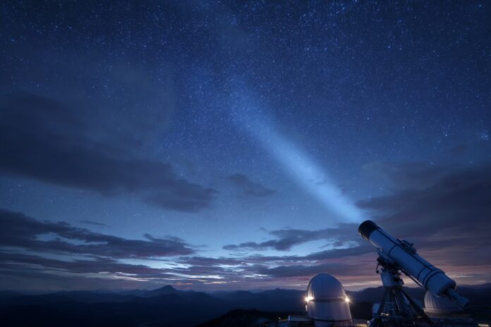 Earth’s shadow cast into space at night, with telescopes observing the clean search zone.