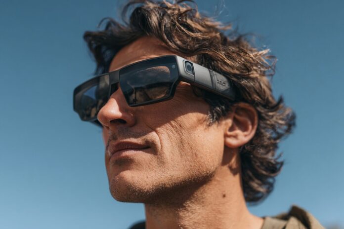 Man wearing Meta Ray-Ban A.I. glasses, interacting hands-free outdoors