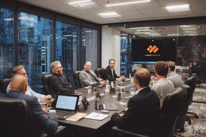 Bitfarms boardroom with executives discussing strategy.
