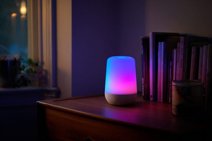 Google Gemini smart speaker illuminated blue and purple