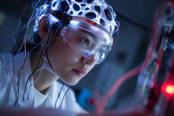 Chinese scientist working on brain-computer interface technology in a laboratory.