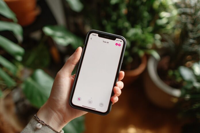 User sending a voice note in TikTok DMs using mobile app