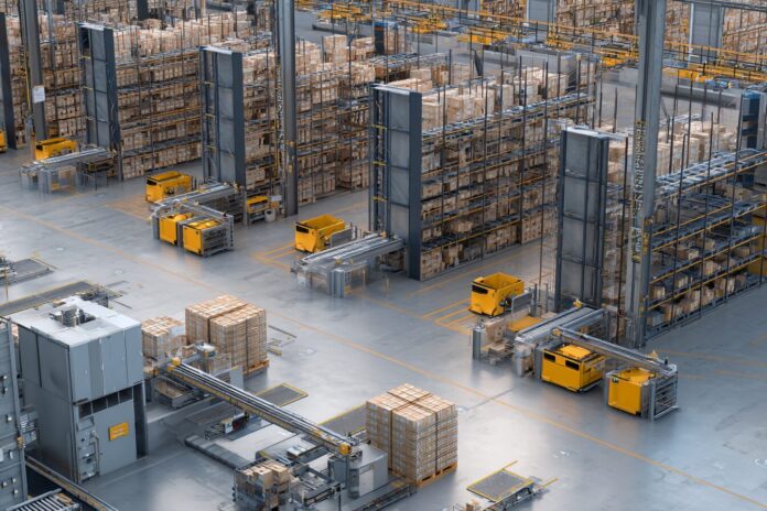 An expansive warehouse floor with hundreds of small robots moving between stacks of grocery products, integrated with automated packing stations.
