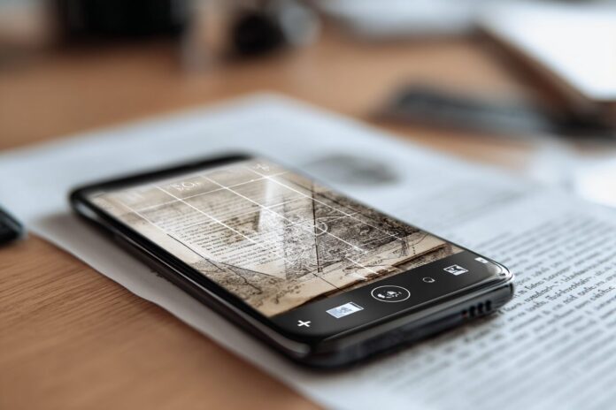 A familiar smartphone screen showing Microsoft Lens scanning a document.