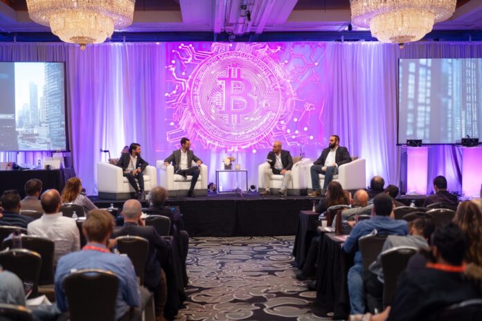 A fintech conference in Canada with investors discussing digital assets on stage.