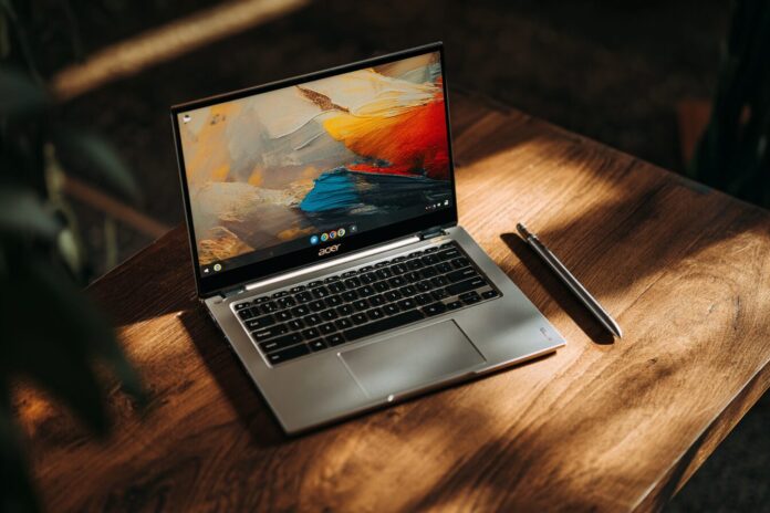 Acer Chromebook Plus Spin 714 on a wooden desk with stylus extended