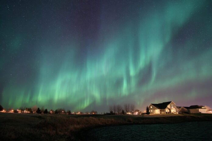 Northern lights over a rural landscape in the United States
