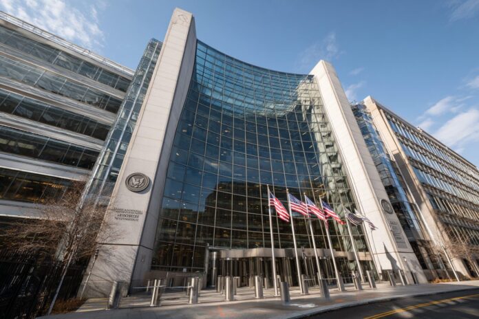 SEC headquarters building in Washington, D.C. with flags and security features.