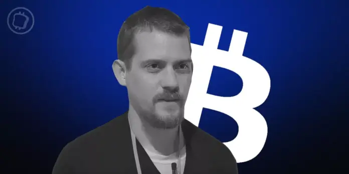 Bitcoin developer Luke Dashjr addressing a conference audience, with tension evident among attendees.