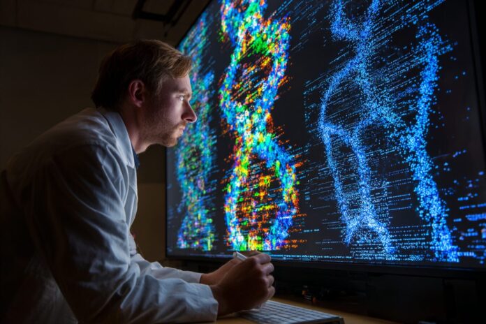 A research scientist reviewing AI-generated DNA sequence data on a large display with bacteriophage graphics
