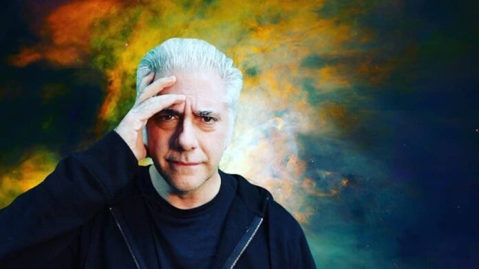 Rick Beato looking concerned while reviewing YouTube copyright strikes on computer screen.